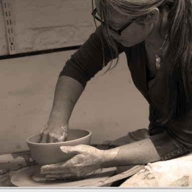 Helen throwing a bowl on the potter's wheel